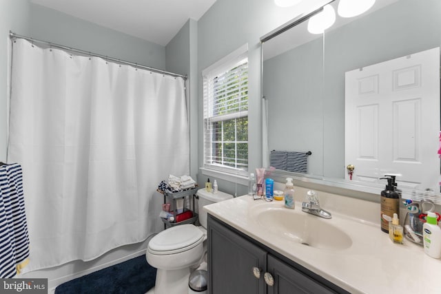 43433 Blair Park Sq, Ashburn, VA 20147 - full bathroom with vanity, toilet, and shower / bathtub combination with curtain