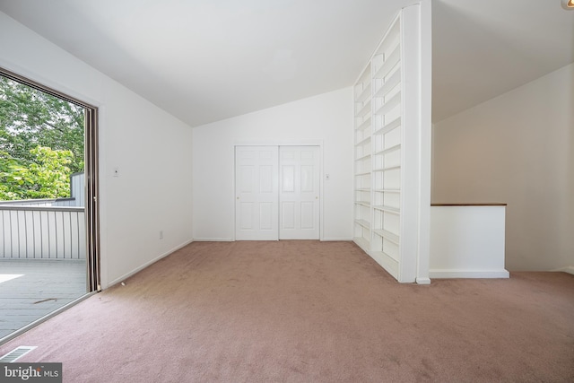 102 W Montgomery Ave Unit A, Ardmore, PA 19003 - bonus room with carpet flooring, vaulted ceiling, built in shelves, and baseboards