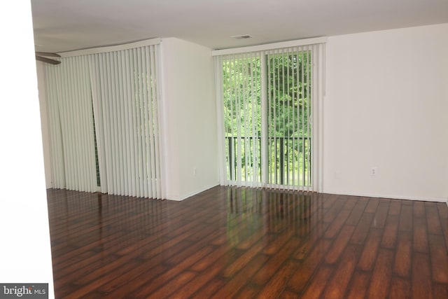 10248 Prince Pl Unit 23-102, Upper Marlboro, MD 20774 - spare room with healthy amount of natural light and wood finished floors