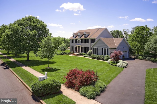 4953 Gloucester Dr, Doylestown, PA 18902 - colonial inspired home featuring asphalt driveway, a front yard, and a garage
