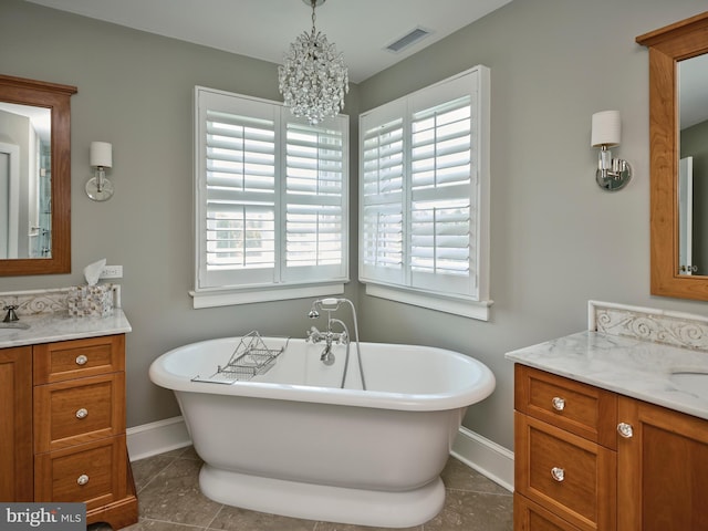 4953 Gloucester Dr, Doylestown, PA 18902 - full bath featuring baseboards, two vanities, plenty of natural light, and a chandelier