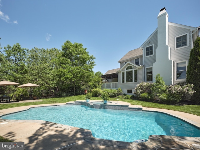 4953 Gloucester Dr, Doylestown, PA 18902 - view of swimming pool with a patio, a pool with connected hot tub, and a yard