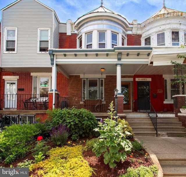 527 S 55th St, Philadelphia, PA 19143 - townhome / multi-family property featuring brick siding and a porch