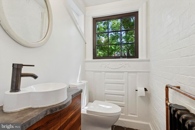 527 S 55th St, Philadelphia, PA 19143 - bathroom with toilet, vanity, and radiator
