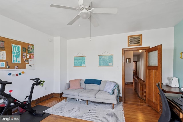 527 S 55th St, Philadelphia, PA 19143 - living room featuring wood finished floors, a ceiling fan, and baseboards