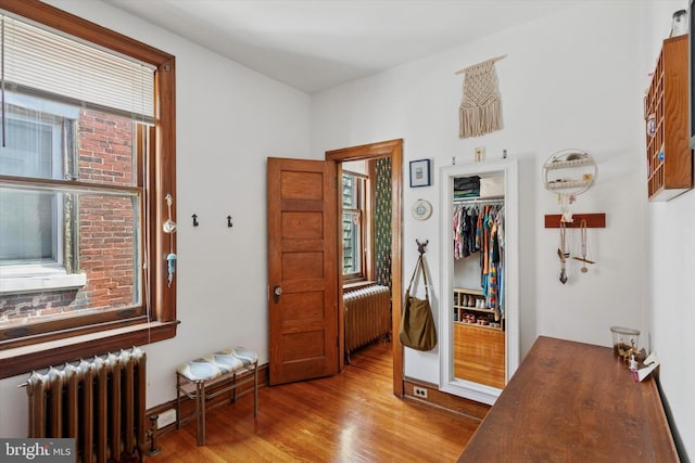 527 S 55th St, Philadelphia, PA 19143 - bedroom with radiator, wood finished floors, a closet, and baseboards