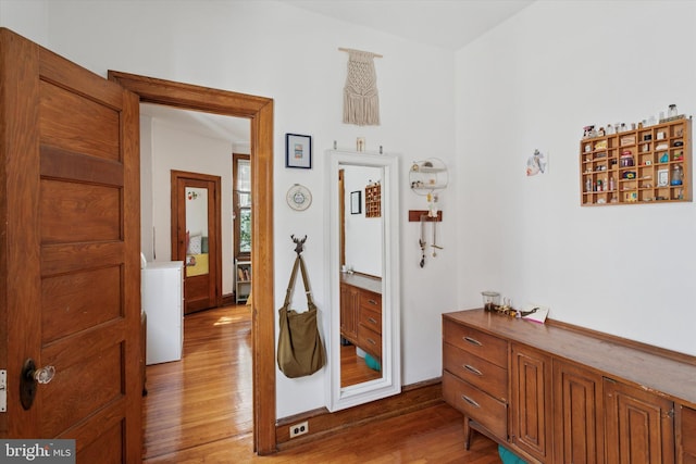 527 S 55th St, Philadelphia, PA 19143 - hallway featuring light wood-style floors and washer / dryer