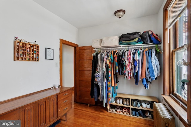 527 S 55th St, Philadelphia, PA 19143 - walk in closet featuring radiator heating unit and wood finished floors