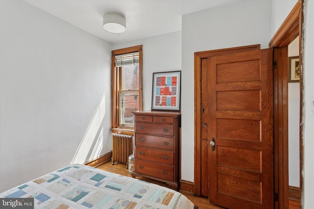 527 S 55th St, Philadelphia, PA 19143 - bedroom with radiator, light wood-style flooring, and baseboards