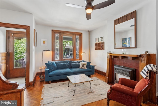 527 S 55th St, Philadelphia, PA 19143 - living area featuring baseboards, healthy amount of natural light, and a ceiling fan