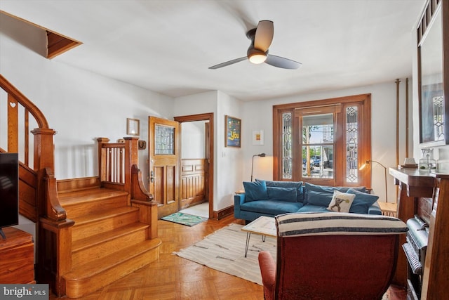 527 S 55th St, Philadelphia, PA 19143 - living room with stairway, a ceiling fan, and baseboards