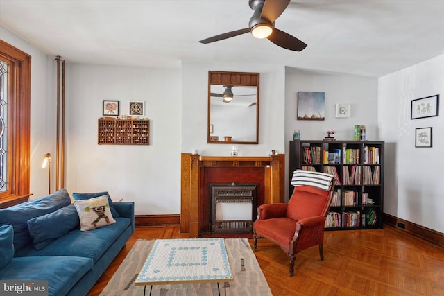 527 S 55th St, Philadelphia, PA 19143 - living room featuring baseboards and ceiling fan