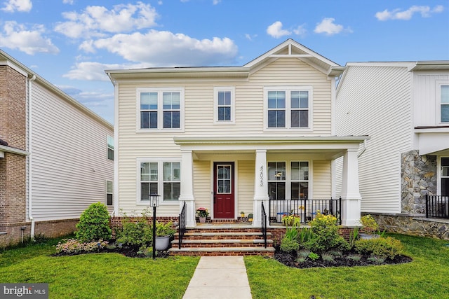42023 Spring Air Dr, Brambleton, VA 20148 - view of front facade featuring covered porch and a front yard