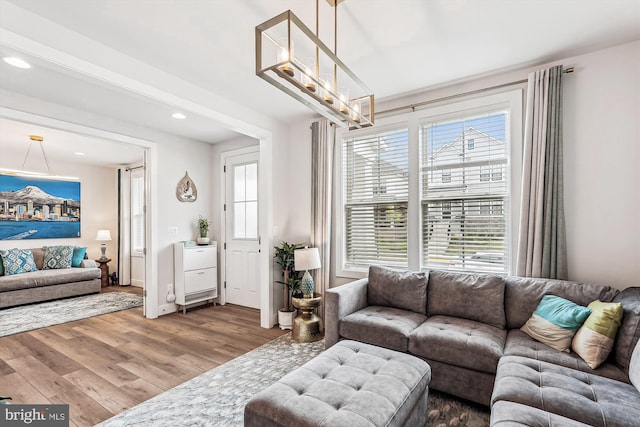 42023 Spring Air Dr, Brambleton, VA 20148 - living area with wood finished floors and recessed lighting