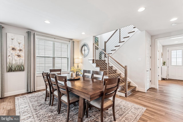 42023 Spring Air Dr, Brambleton, VA 20148 - dining room with light wood finished floors, recessed lighting, stairs, and baseboards