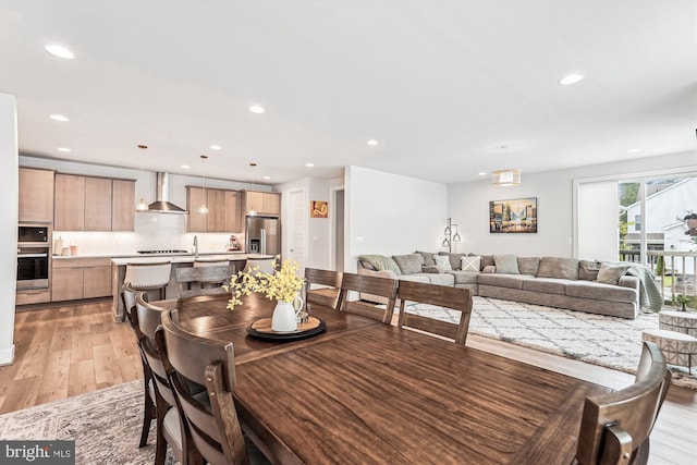 42023 Spring Air Dr, Brambleton, VA 20148 - dining area with light wood-style flooring and recessed lighting