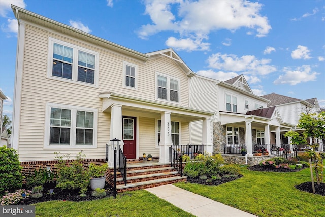 42023 Spring Air Dr, Brambleton, VA 20148 - view of front of home with covered porch and a front yard
