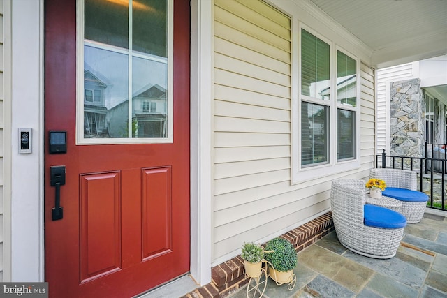 42023 Spring Air Dr, Brambleton, VA 20148 - doorway to property with covered porch