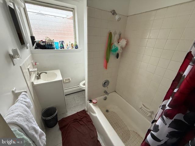 442 E Baltimore Ave, Clifton Heights, PA 19018 - full bathroom with a baseboard heating unit, vanity, shower / bathtub combination with curtain, toilet, and tile patterned floors
