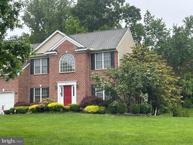 2010 Wagner Farm Rd, Bel Air, MD 21015 - colonial-style house with a front lawn, brick siding, a shingled roof, and a garage
