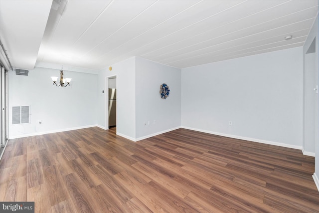 2300 Riddle Ave Unit A4, Wilmington, DE 19806 - spare room featuring a chandelier, dark wood finished floors, and baseboards