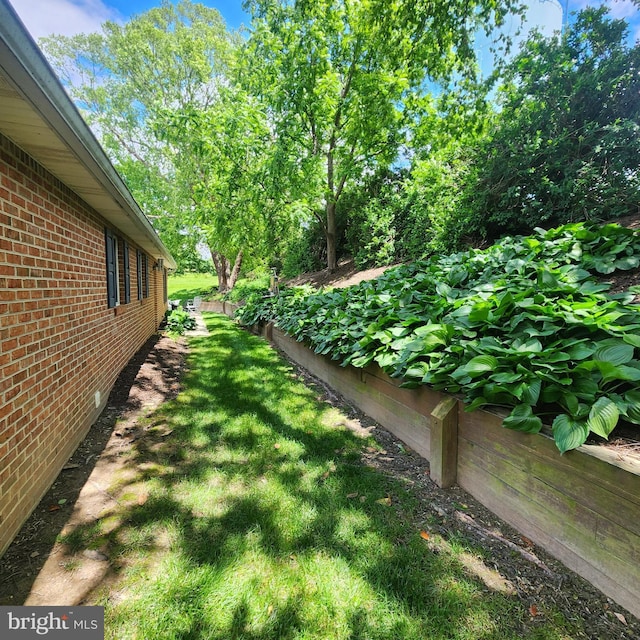 2807 Carlisle Dr Unit 29, New Windsor, MD 21776 - view of green lawn featuring a garden
