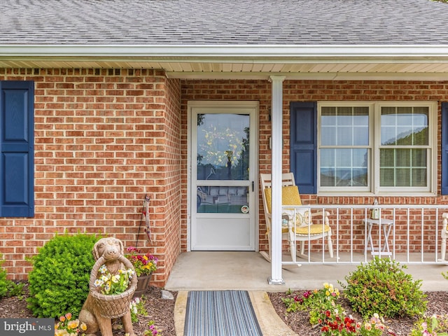 2807 Carlisle Dr Unit 29, New Windsor, MD 21776 - entrance to property with a shingled roof, brick siding, and covered porch