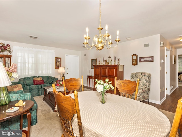 2807 Carlisle Dr Unit 29, New Windsor, MD 21776 - dining area with a chandelier, wood finished floors, baseboards, and plenty of natural light