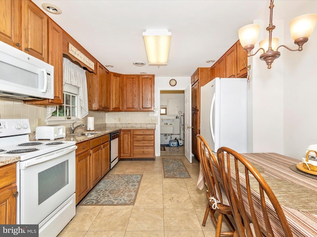 2807 Carlisle Dr Unit 29, New Windsor, MD 21776 - kitchen with white appliances, brown cabinets, decorative backsplash, a sink, and light stone counters