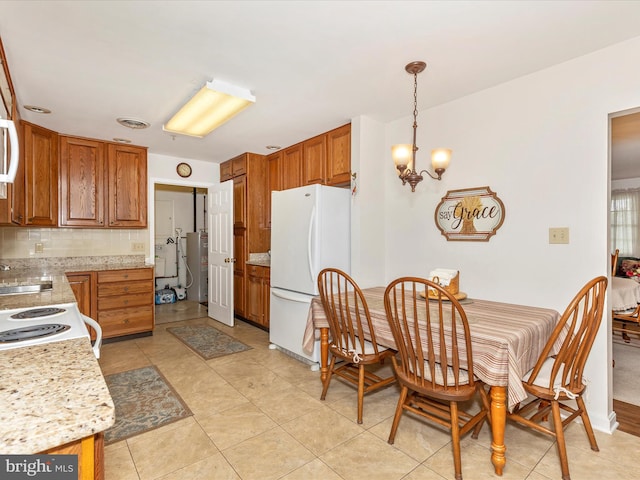 2807 Carlisle Dr Unit 29, New Windsor, MD 21776 - kitchen with white appliances, a chandelier, decorative backsplash, brown cabinets, and light tile patterned floors