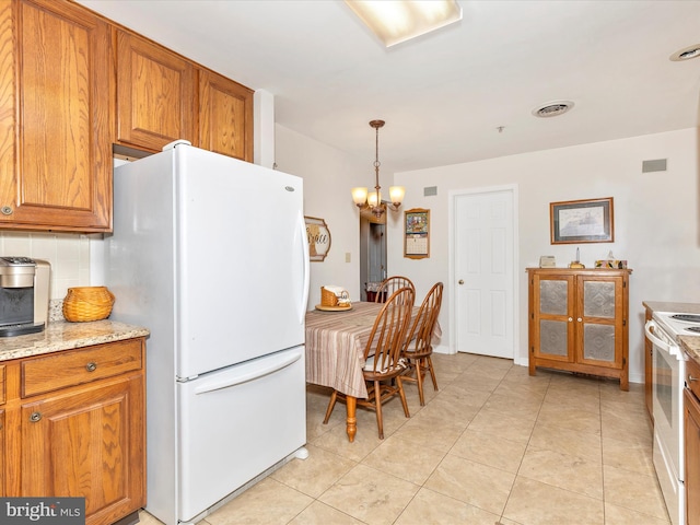 2807 Carlisle Dr Unit 29, New Windsor, MD 21776 - kitchen featuring white appliances, brown cabinetry, tasteful backsplash, and a chandelier