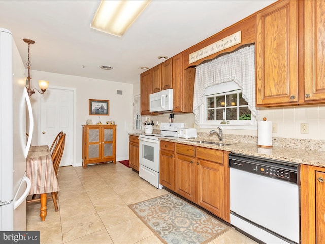 2807 Carlisle Dr Unit 29, New Windsor, MD 21776 - kitchen featuring white appliances, a sink, light stone countertops, and brown cabinetry