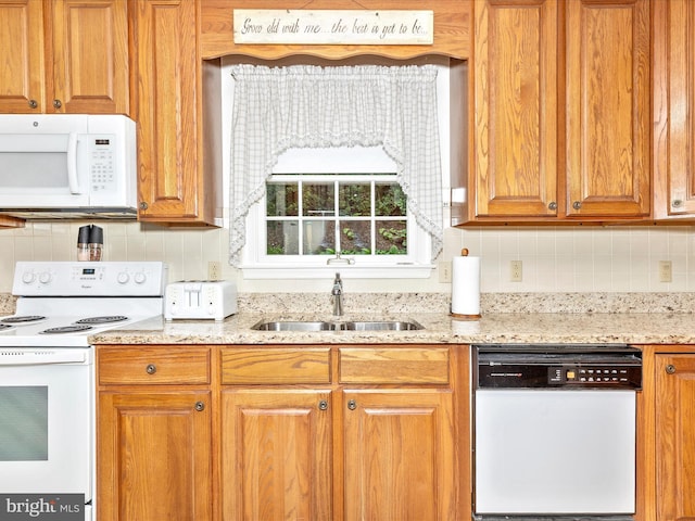2807 Carlisle Dr Unit 29, New Windsor, MD 21776 - kitchen with white appliances, a sink, tasteful backsplash, light stone counters, and brown cabinetry