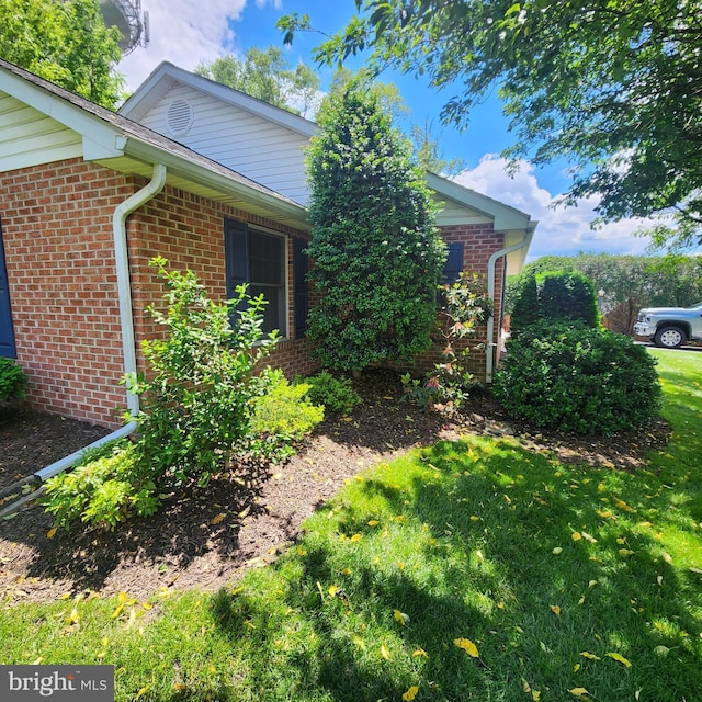 2807 Carlisle Dr Unit 29, New Windsor, MD 21776 - view of side of home featuring brick siding and a lawn