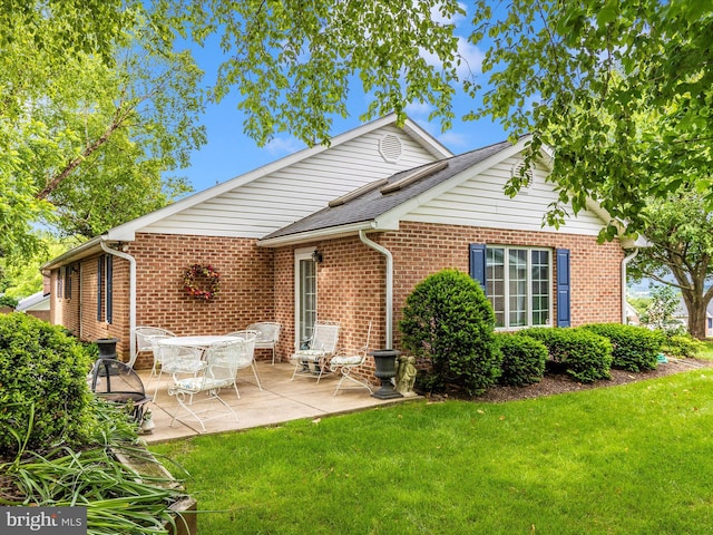 2807 Carlisle Dr Unit 29, New Windsor, MD 21776 - back of property featuring a lawn, brick siding, and a patio
