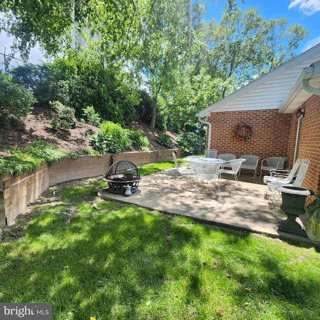 2807 Carlisle Dr Unit 29, New Windsor, MD 21776 - view of green lawn featuring a fire pit and a patio