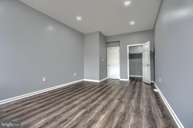 1940 W N Ave, Baltimore, MD 21217 - unfurnished bedroom featuring dark wood finished floors, baseboards, and recessed lighting