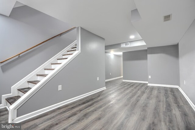 1940 W N Ave, Baltimore, MD 21217 - finished below grade area featuring wood finished floors, baseboards, and stairway