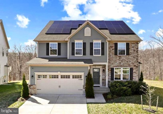 12296 Revolution Ct, Waldorf, MD 20602 - view of front of house with stone siding, concrete driveway, roof mounted solar panels, and a garage