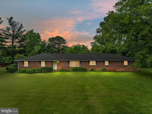 717 W Locust St, Woodstock, VA 22664 - single story home with a yard, brick siding, a chimney, and view of wooded area