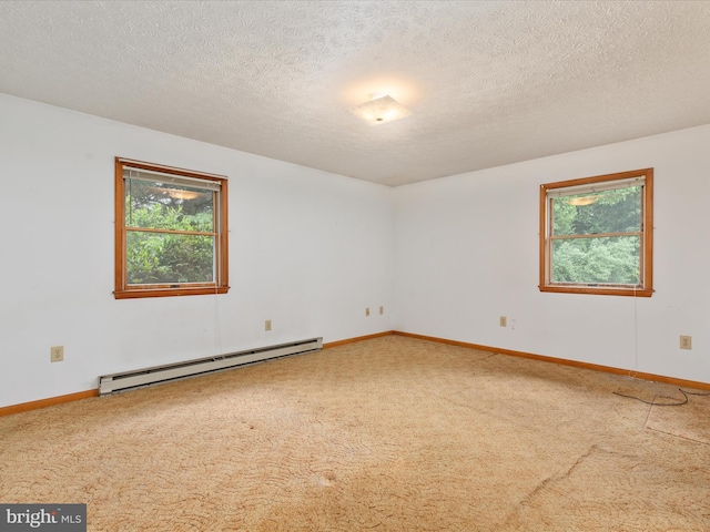 717 W Locust St, Woodstock, VA 22664 - empty room with baseboard heating, plenty of natural light, carpet, a textured ceiling, and baseboards
