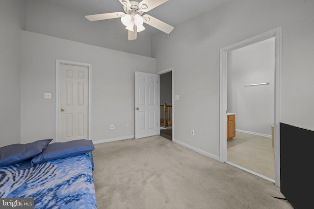 273 Thomas Harmon Dr, Camden Wyoming, DE 19934 - unfurnished bedroom featuring light carpet, baseboards, a high ceiling, ensuite bath, and ceiling fan