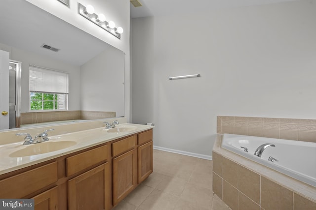 273 Thomas Harmon Dr, Camden Wyoming, DE 19934 - full bathroom with a garden tub, tile patterned floors, and double vanity