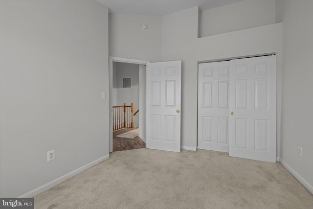 273 Thomas Harmon Dr, Camden Wyoming, DE 19934 - unfurnished bedroom with carpet, baseboards, a towering ceiling, and a closet