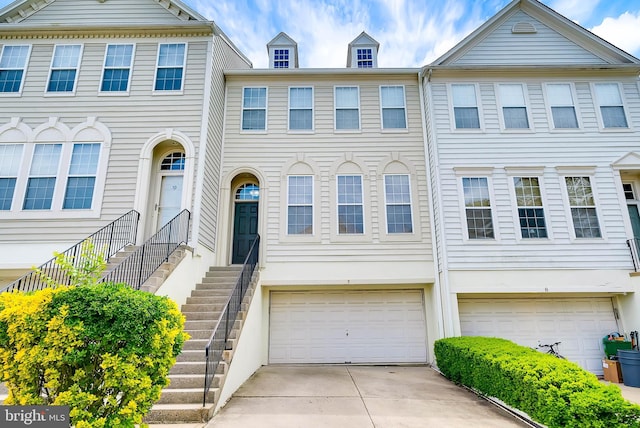 9 Cherry Ct, Lafayette Hill, PA 19444 - townhome / multi-family property with a garage and driveway