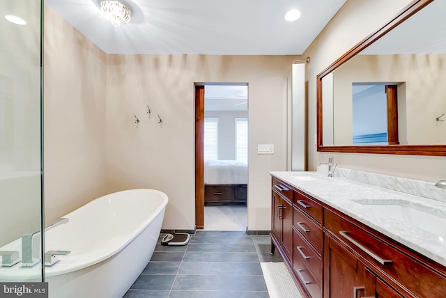 9 Cherry Ct, Lafayette Hill, PA 19444 - bathroom featuring double vanity, a freestanding bath, connected bathroom, baseboards, and recessed lighting