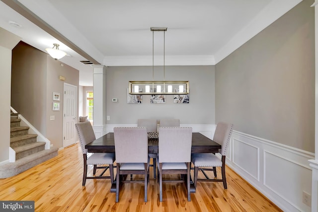9 Cherry Ct, Lafayette Hill, PA 19444 - dining space with light wood-style flooring, a wainscoted wall, stairs, and ornamental molding