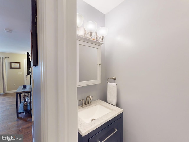106 Pebble Ln, Bellefonte, PA 16823 - bathroom featuring vanity, wood finished floors, and baseboards