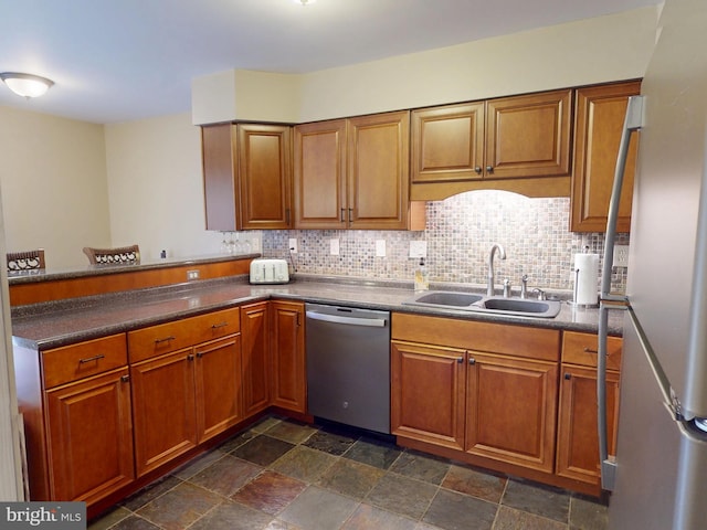 106 Pebble Ln, Bellefonte, PA 16823 - kitchen with stainless steel appliances, a sink, and brown cabinets