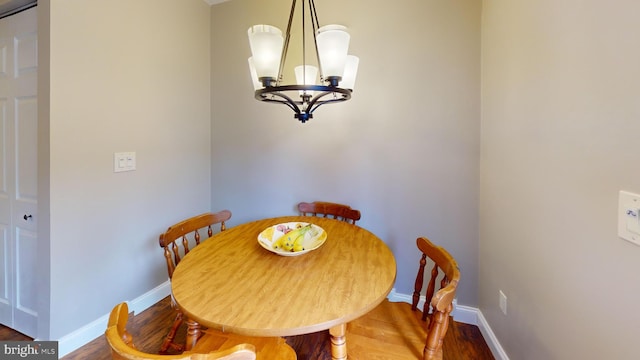 106 Pebble Ln, Bellefonte, PA 16823 - dining room featuring a chandelier, wood finished floors, and baseboards
